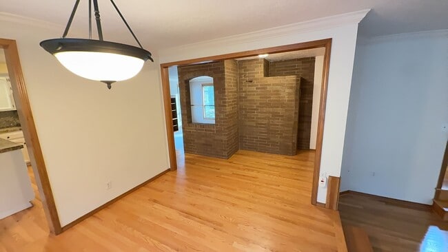 Building Photo - 4bd/3ba HUGE Home w/Hardwood Floors, Russian Fireplace, 2-Car Garage & Fenced Back Yard!