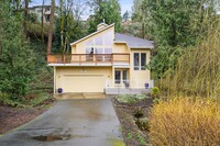 Building Photo - Forested, updated 3-bdr/2-bath contemporar...