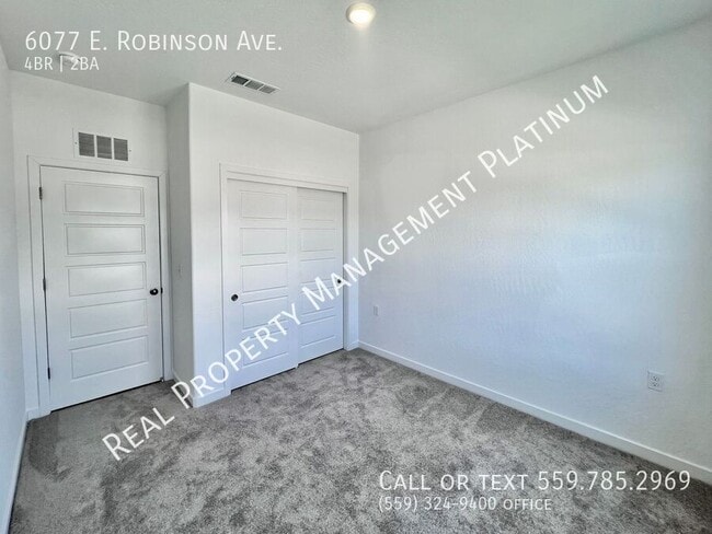 Building Photo - 6077 E Robinson Ave