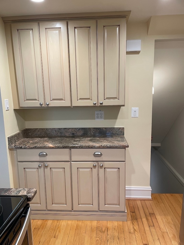 Kitchen cabinets with granite counter tops. Entrance to basement. - 1620 Graefield Rd