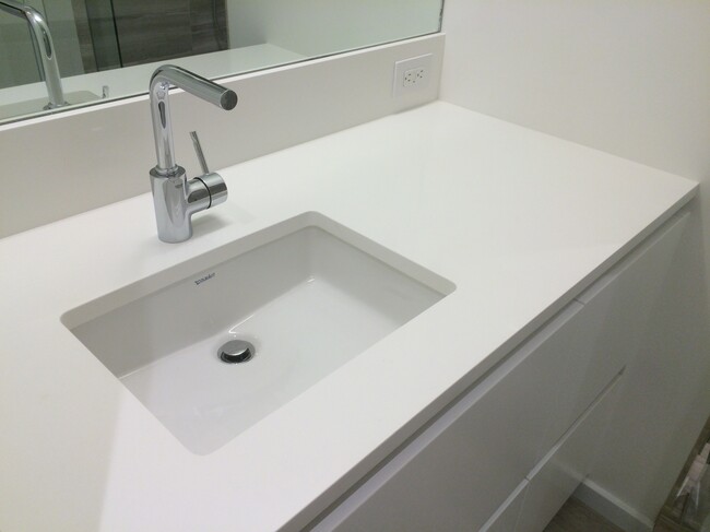 Pedini bathroom with quartz surfaces - 1075 NW Northrup St