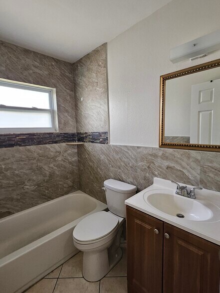 Updated bathroom. - 1735 S Washington Ave