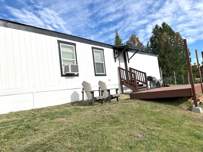 Great backyard on 10 acres. Deck under construction in the picture-now completed. - 2365 Washington St