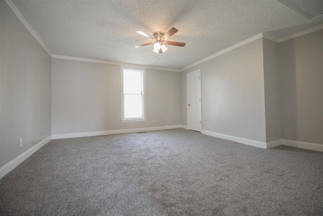 Brand new carpet, windows, paint and fans in both bedrooms - 725 North Academy Street