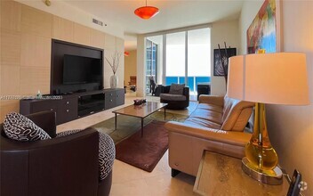 Building Photo - 15811 Collins Ave