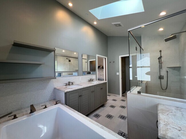 Building Photo - Spacious 4-Bedroom Retreat Just Steps from...