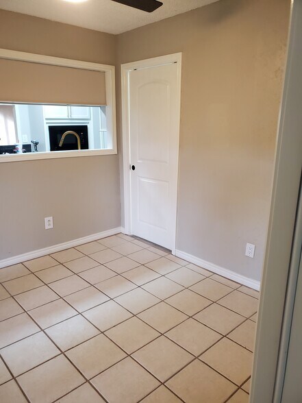 Breakfast nook open to kitchen, pocket door to utility - 106 N Troy Ave