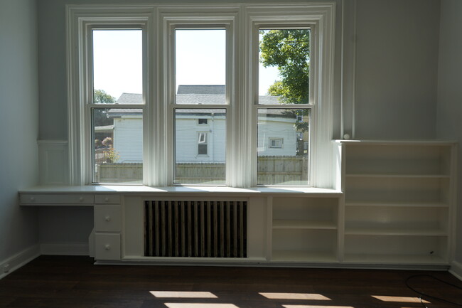 Living room with built in bookshelf and desk - 422 Busti Ave