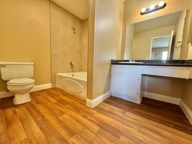 Building Photo - THIS SECOND-FLOOR DESERT SHORES CONDO OFFE...
