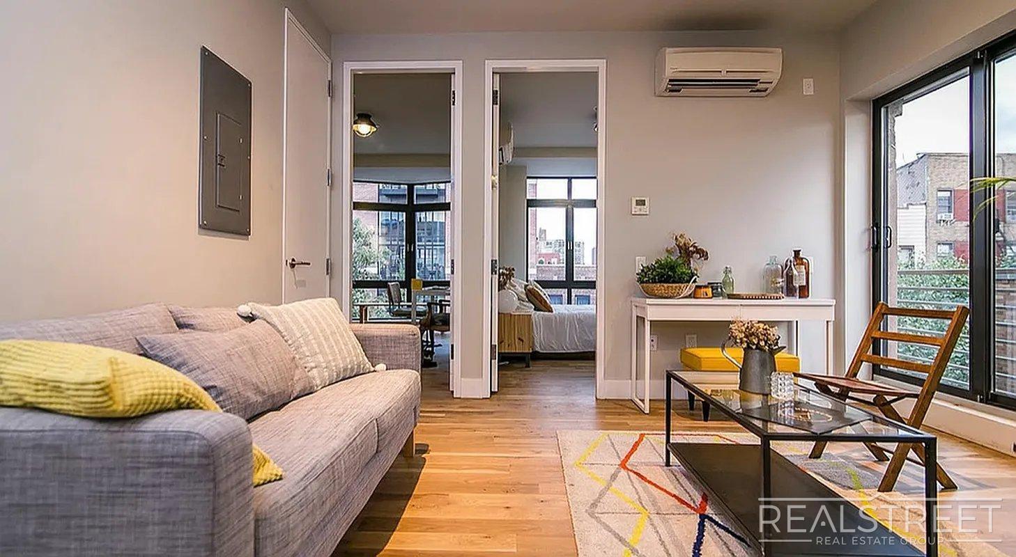 Building Photo - Bright 2 Bed / 1 Bath Loft-Style Residence with Multiple Balconies & Premium Amenities