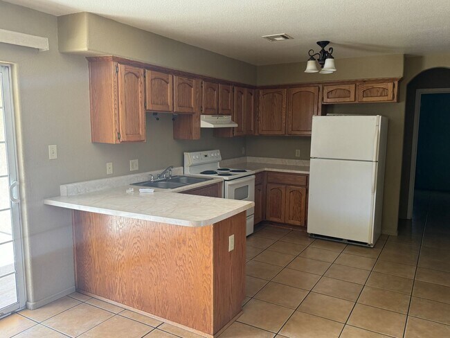 Building Photo - Enjoy this Fully Fenced San Luis Home