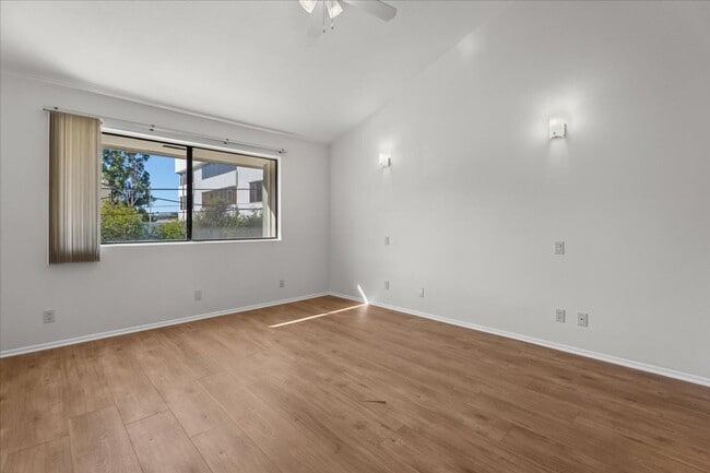 Building Photo - Light Filled Townhome Style Condo with Private Patios and Direct Access