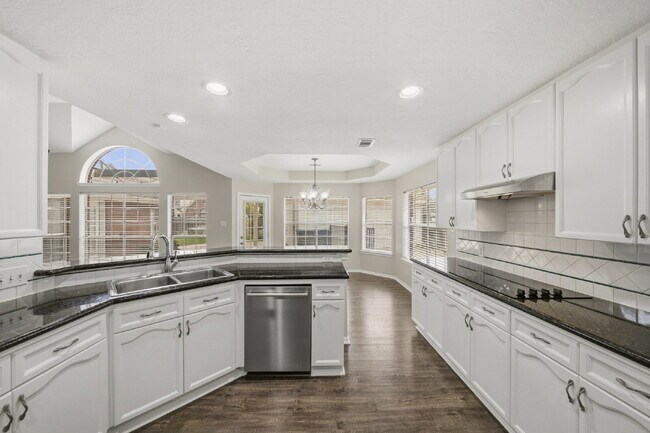 Building Photo - Refreshed 4-Bedroom in New Territory with New Paint, New Floors, and Lawn Care Included.