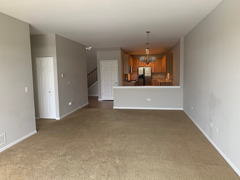 Functional family room with fireplace and sliding doors to balcony - 281 Hickory Lane