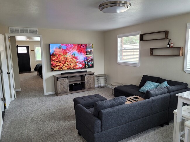 75 inch flat screen with sound system - 1550 Oak Ct