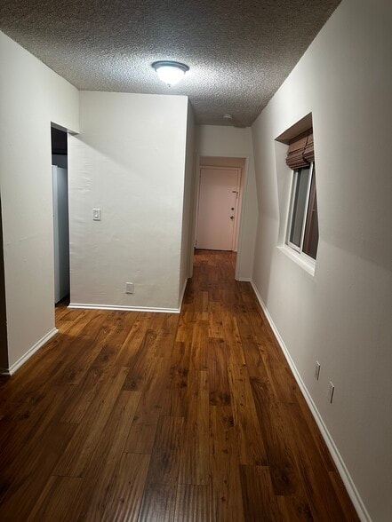 Hallway from living room and kitchen to bedroom and bath - 8711 Pershing Dr