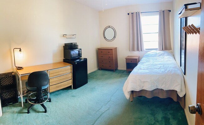 Furnished with an extra long twin bed, desk, office chair, small refridgerator, microwave, dressor - 2512 SW 113th Ct