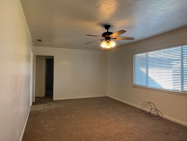 Building Photo - Updated 3 bedroom 2 bathroom home with large backyard, corner lot, close to shopping and schools ...