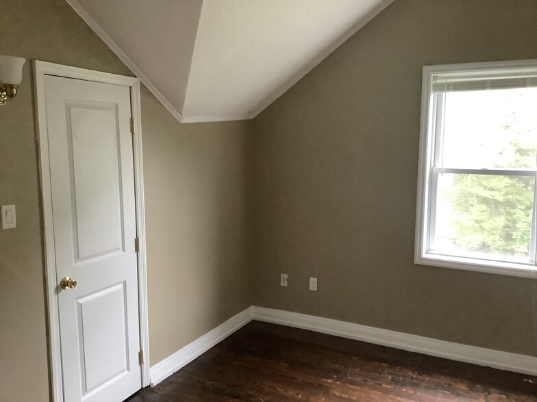 Bedroom 2 overlooks the back yard and measures 13' by 10'. - 11 Jay St