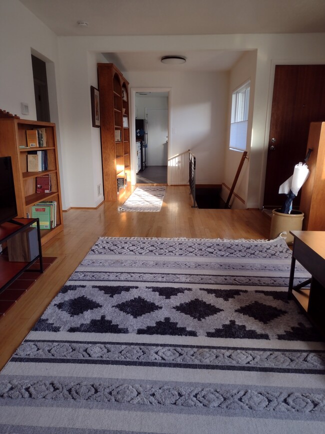 Soft light from Southern windows. Looking from Living Room towards the Kitchen. Stairs to downstairs - 4157 SE Brooklyn St