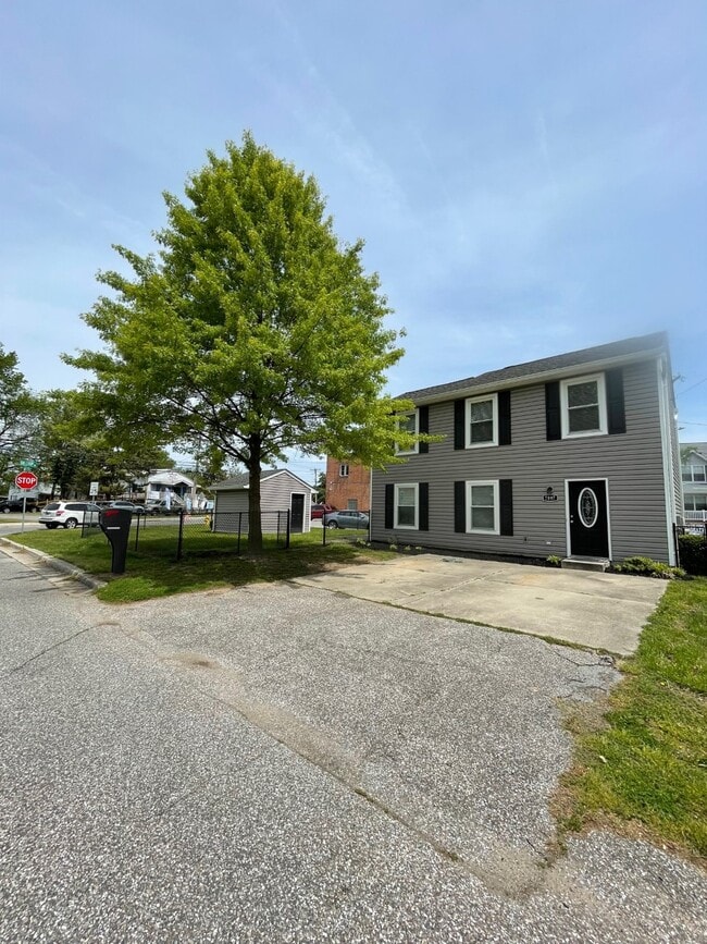 Front Elevation and Parking - 7897 W End Dr