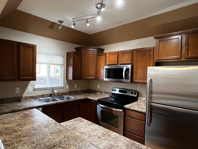 Kitchen from Dining Half Wall - 5021 Mountain Man Ln