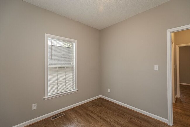 Building Photo - Like New Home off Freeman Mill. Just Painted, New Wood/Vinyl Flooring, Vaulted Ceilings, Front Po...