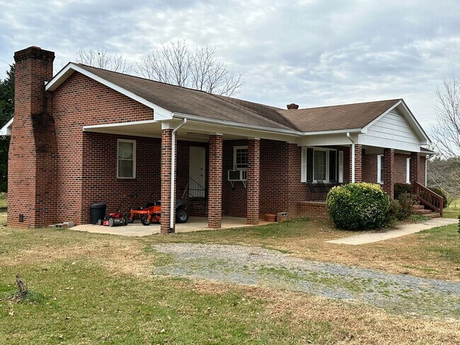 Building Photo - 4-Bedroom Brick Home with Full Unfinished ...