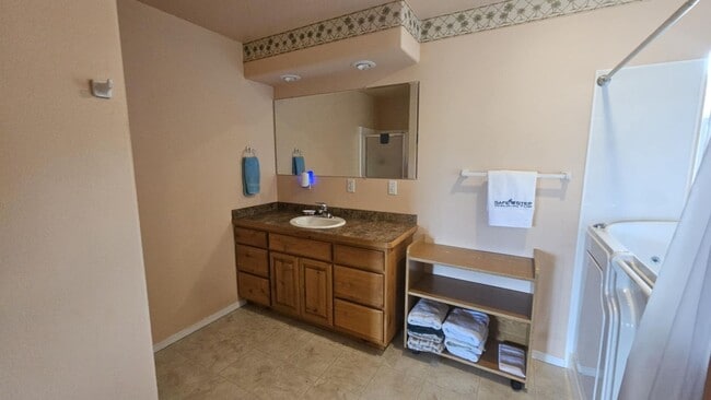 Building Photo - Out of town house with double garage and l...