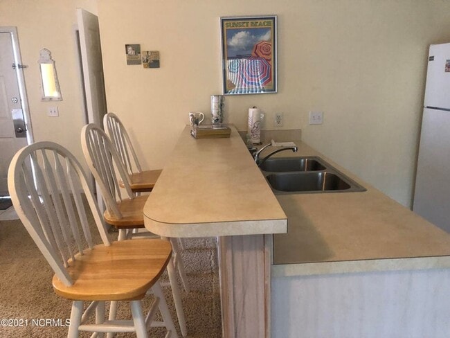 Building Photo - FULLY FURNISHED CONDO in sought-after Sea Trail subdivision!