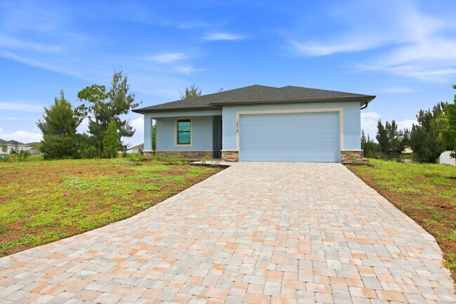 Building Photo - Brand New Canal-Front Pool Home for Rent, 3/2/2, NE Cape Coral. The Builder Didn't Cut Corners, S...