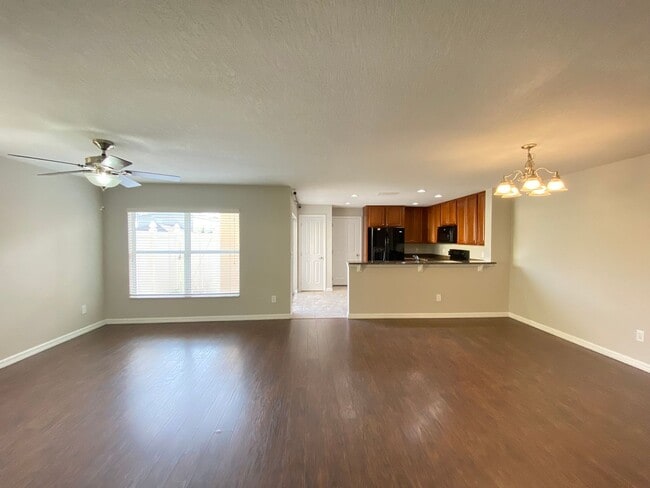 Building Photo - Avalon Park corner end Townhome featuring 3 bedrooms, 2.5 baths, plus office, and 2 car garage.