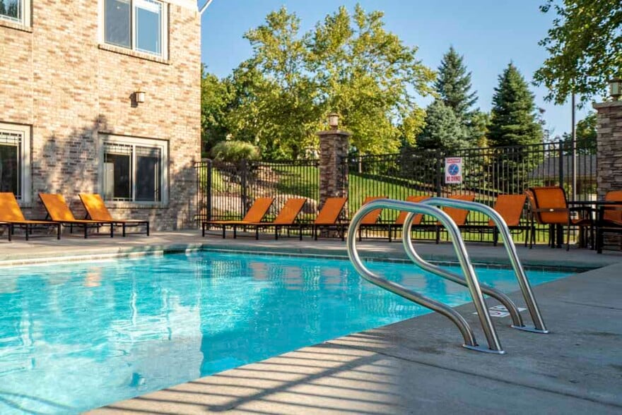 Relax and unwind by the swimming pool on sunny afternoons. - Grand Legacy