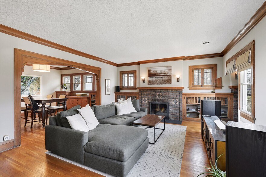 The wood burning fireplace will keep you cozy in the winter. - 4445 Colfax Avenue South