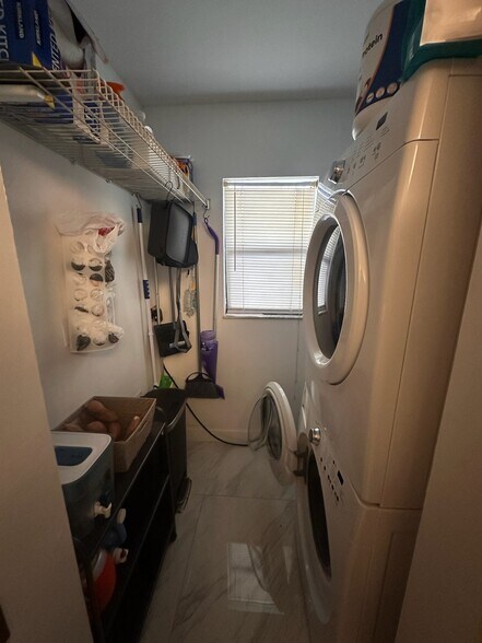 Washer, dryer, and new electric water heater - 2918 NE 8th Ter
