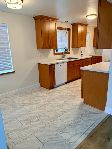 Vinyl tile and quartz countertops - 10734 35th Ave NE