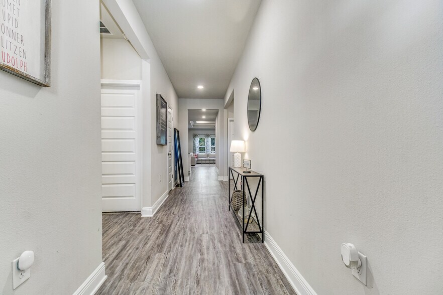Entry hall. Bedrooms #1/#2 on left - 3618 Hawks Landing Cir