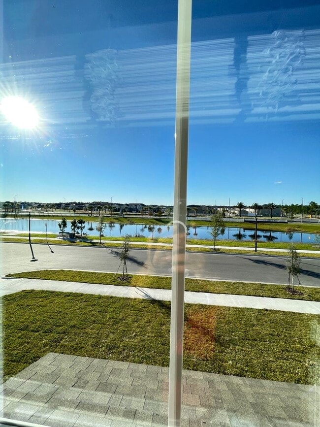 Building Photo - Newly Built, Water View, Luxury Executive 3 BR Lake Nona area corner townhome with an exclusive l...
