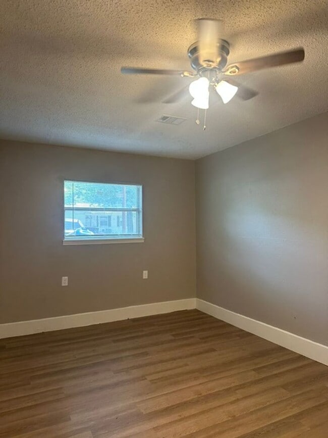 Building Photo - 4/1.5 PTISD Fenced yard and pet friendly
