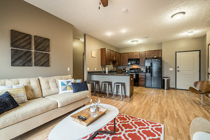 Open-concept layouts seamlessly connect the kitchen and living space, making it easy to cook, dine, and unwind in style. - Villas of Omaha at Butler Ridge