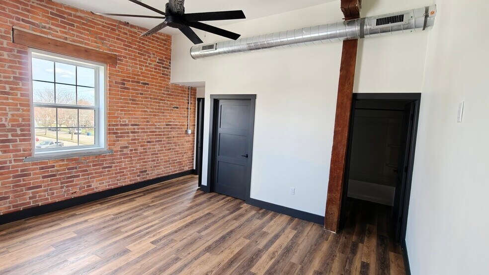 Primary bedroom is large with great light. Features bathroom and walk-in closet - 101 W Broadway St