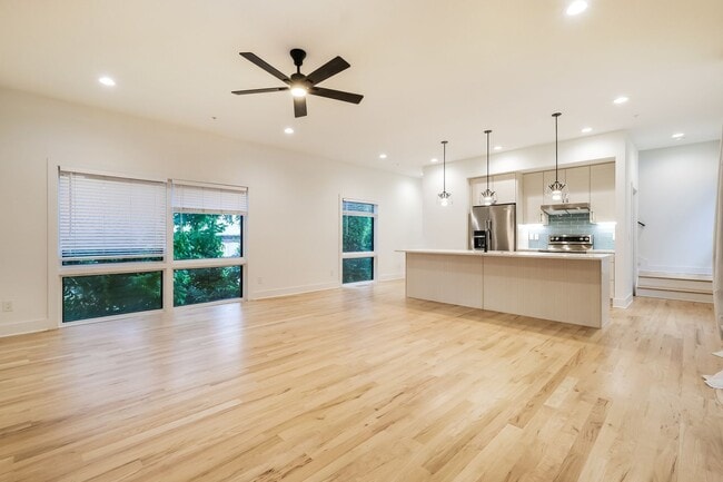 Building Photo - 50% OFF APPLICATION FEE! Sleek 2BR Townhome-Style Condo with Rooftop Deck