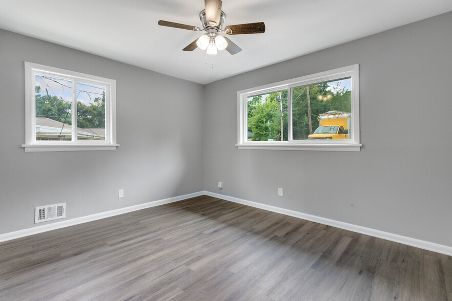 Master bedroom with large window to front yard - 2058 Nettie Ct