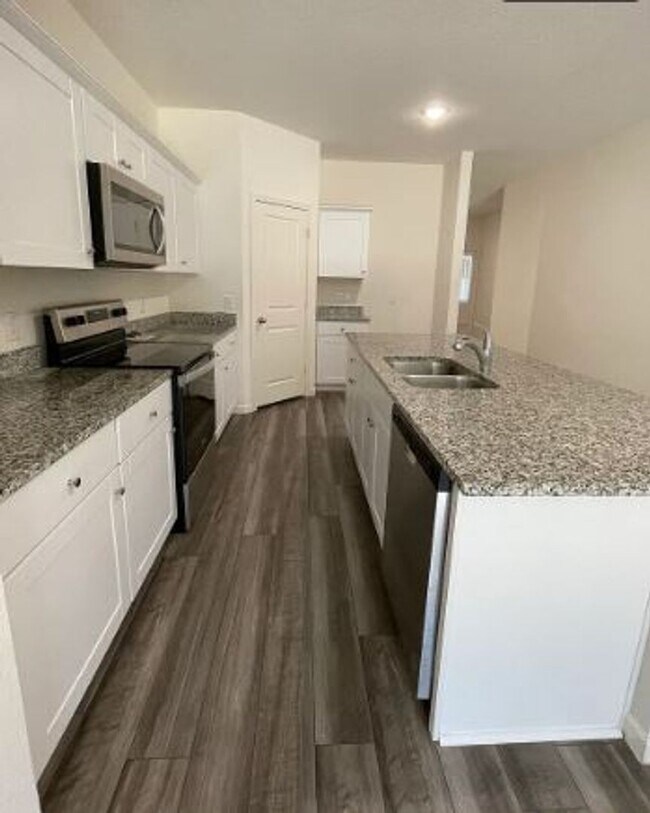 Building Photo - Backs to Wooded Area • Split Bedrooms • Modern & All-Electric