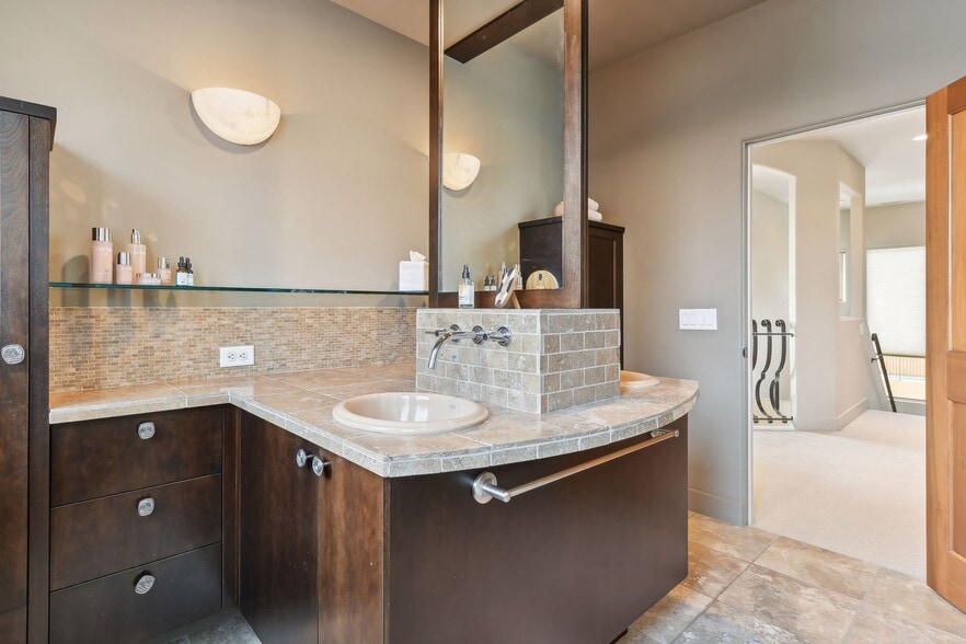 Double sinks, plenty of counter space, and ample storage cabinets in the 3/4 upper level bathroom - 745 Rice St E