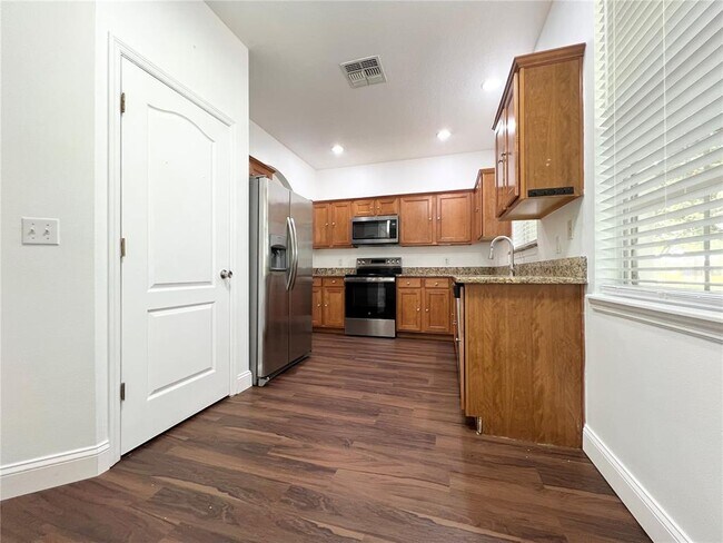 Building Photo - 7138 Five Oaks Dr