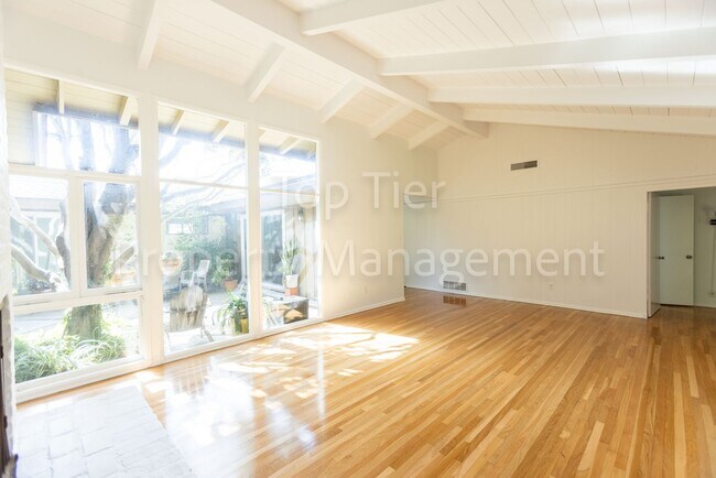 Building Photo - Charming Mid-Century Home | 4BR, 3BA | 2,4...