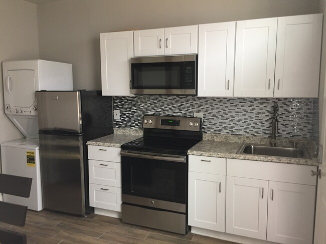 Full Kitchen with oven/range, granite countertops, washer/dryer, and stainless steal applicnes - 5521 Darling St