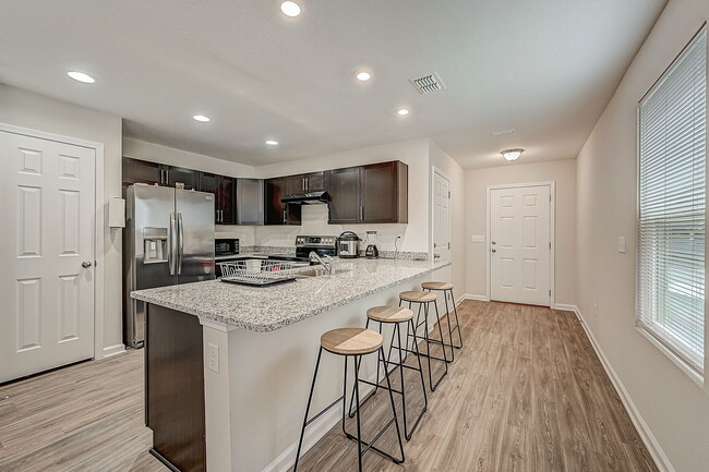 New refrigerator & oven. Four barstools included. - 9081 India Ave