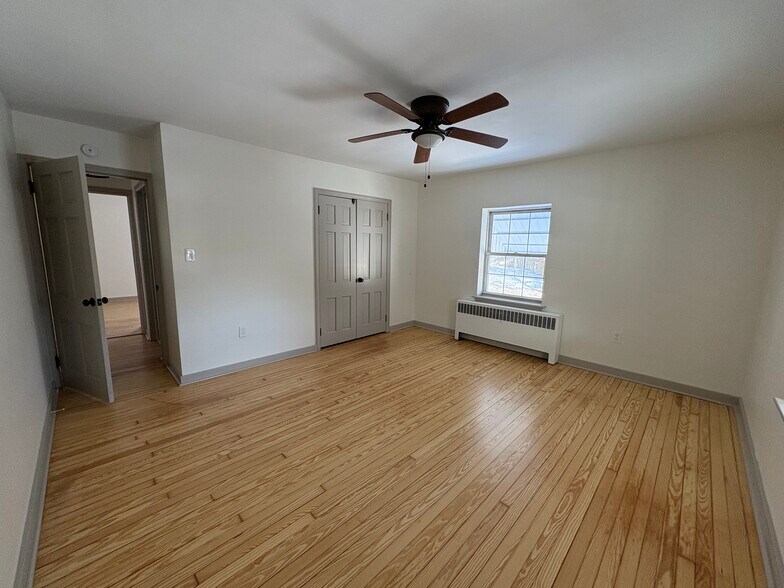 Bedroom with updated windows and fresh paint - 412 Grand Ave